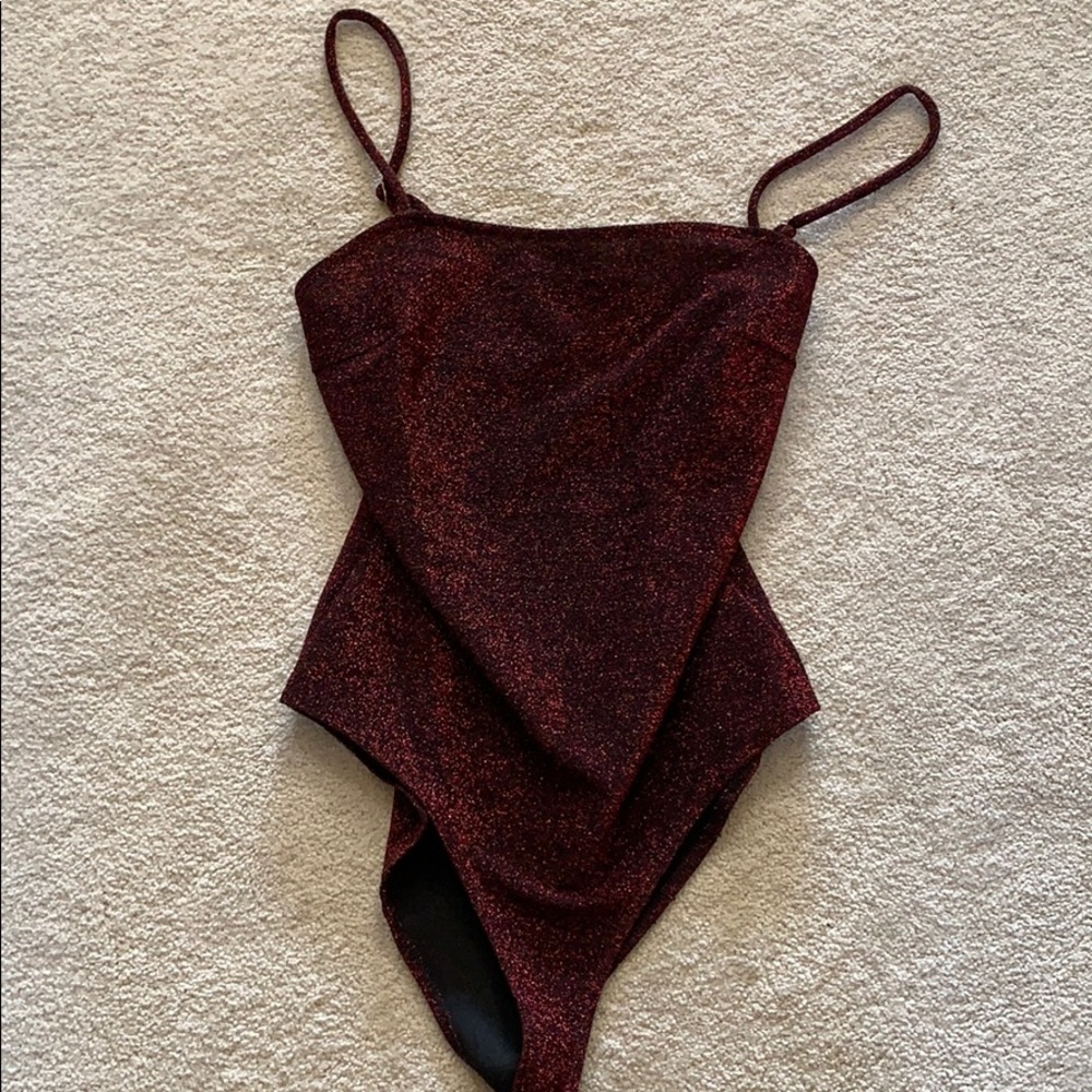 Sparkly red body suit